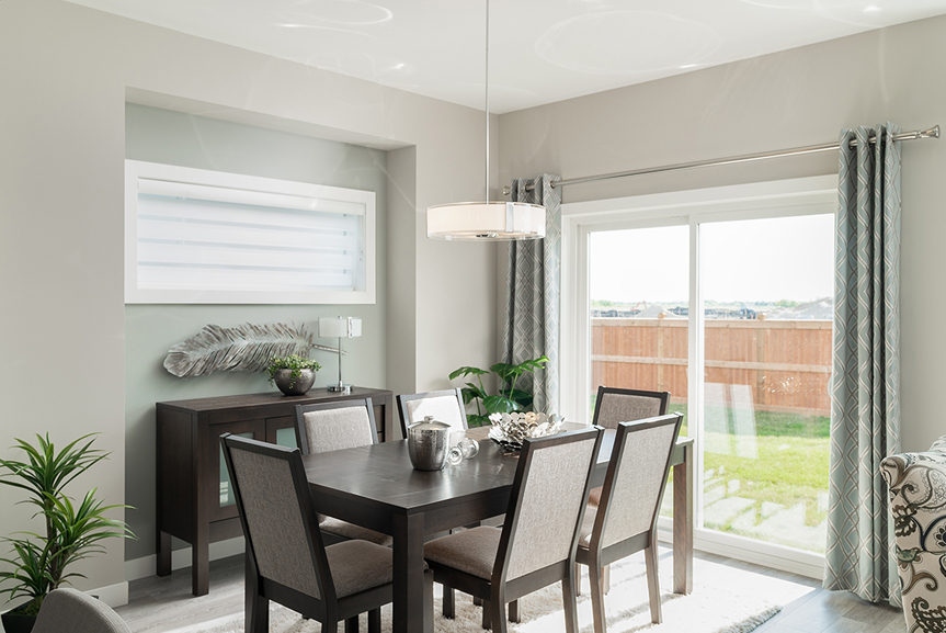 eating area with beige painted walls, double patio door broadview homes winnipeg the preston